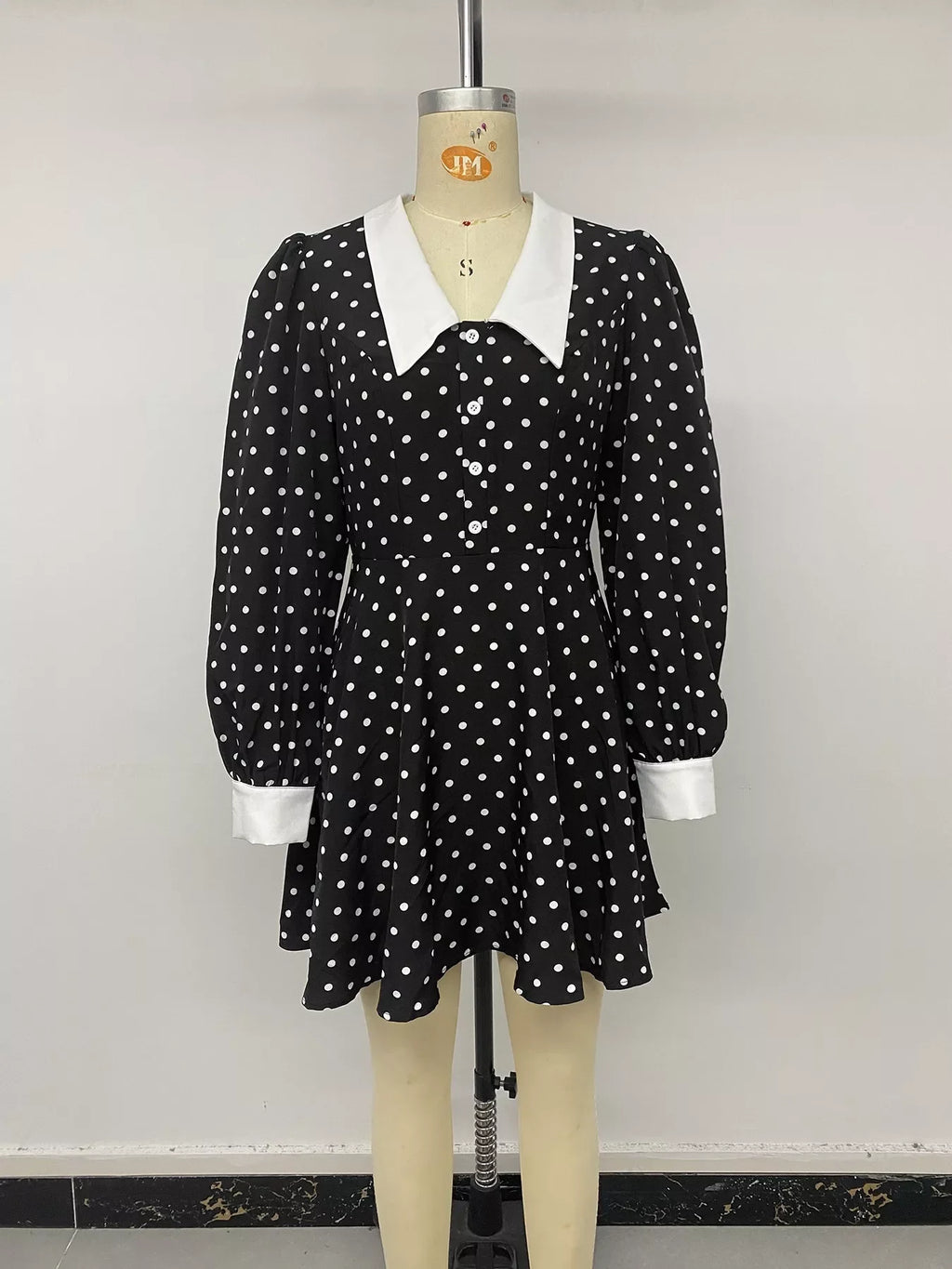 Polka dot Peter Pan collar dress by Shopimist featuring a classic black and white pattern and a flattering fit.