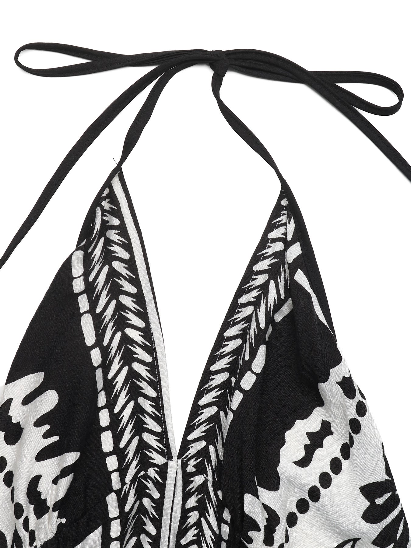 Women's printed halter neck maxi dress with tie-back detail from Plush Fashion Hub, featuring a flowing design and vibrant pattern.