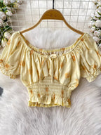 Smocked floral top and skirt set by Shopimist featuring a coordinated, lightweight fabric with a feminine, boho style.