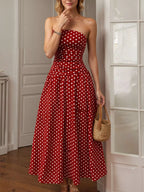 Polka dot strapless maxi dress by Shopimist featuring a flowing silhouette and bold black and white dot pattern.
