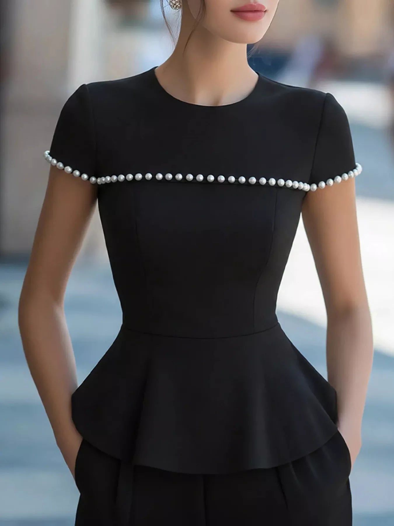 Pearl-embellished Plush Fashion Hub peplum T-shirt with short sleeves and round neckline, stylish and trendy top for casual wear.