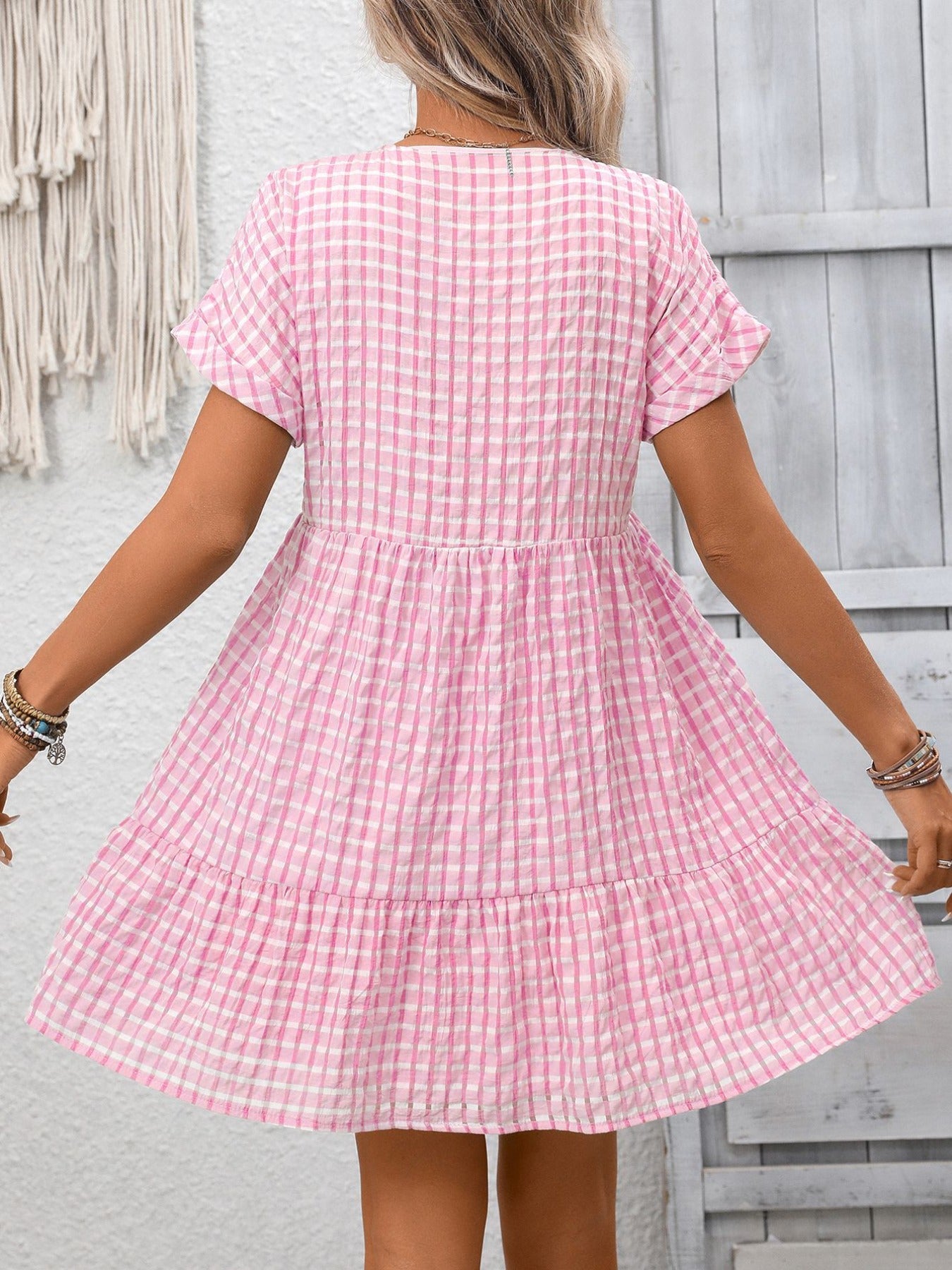 Lightweight plaid V-neck mini dress with ruffle hem from Plush Fashion Hub, perfect for seasonal fashion and casual wear.