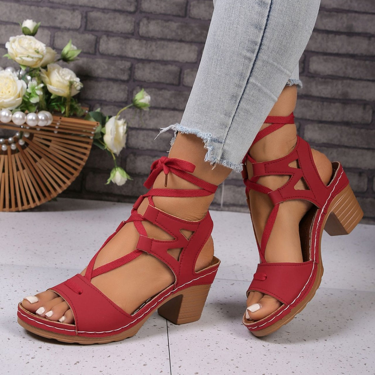 Women's chic lace-up block heel sandals with strappy design and mid-height heel, perfect for stylish summer footwear.