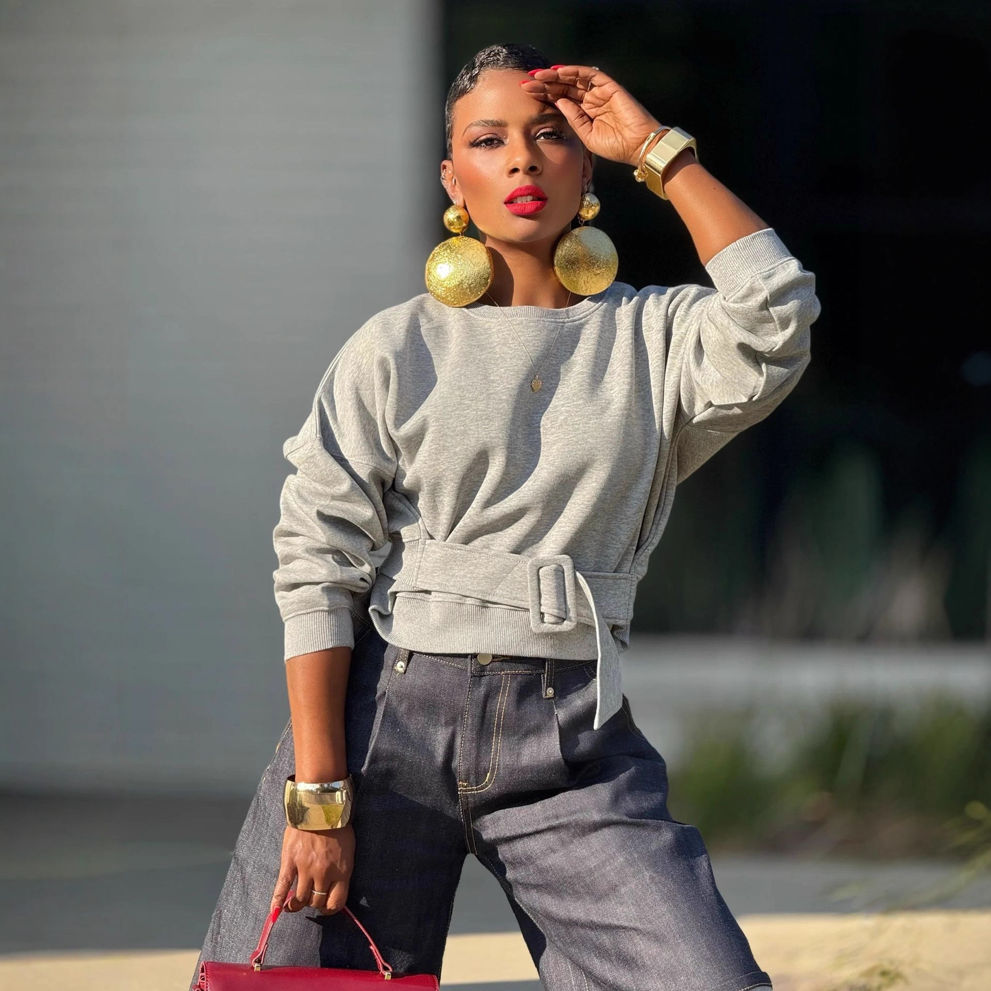 Plush Fashion Hub hooded crop sweatshirt with adjustable belt, casual streetwear style, featuring a hood and cropped fit.
