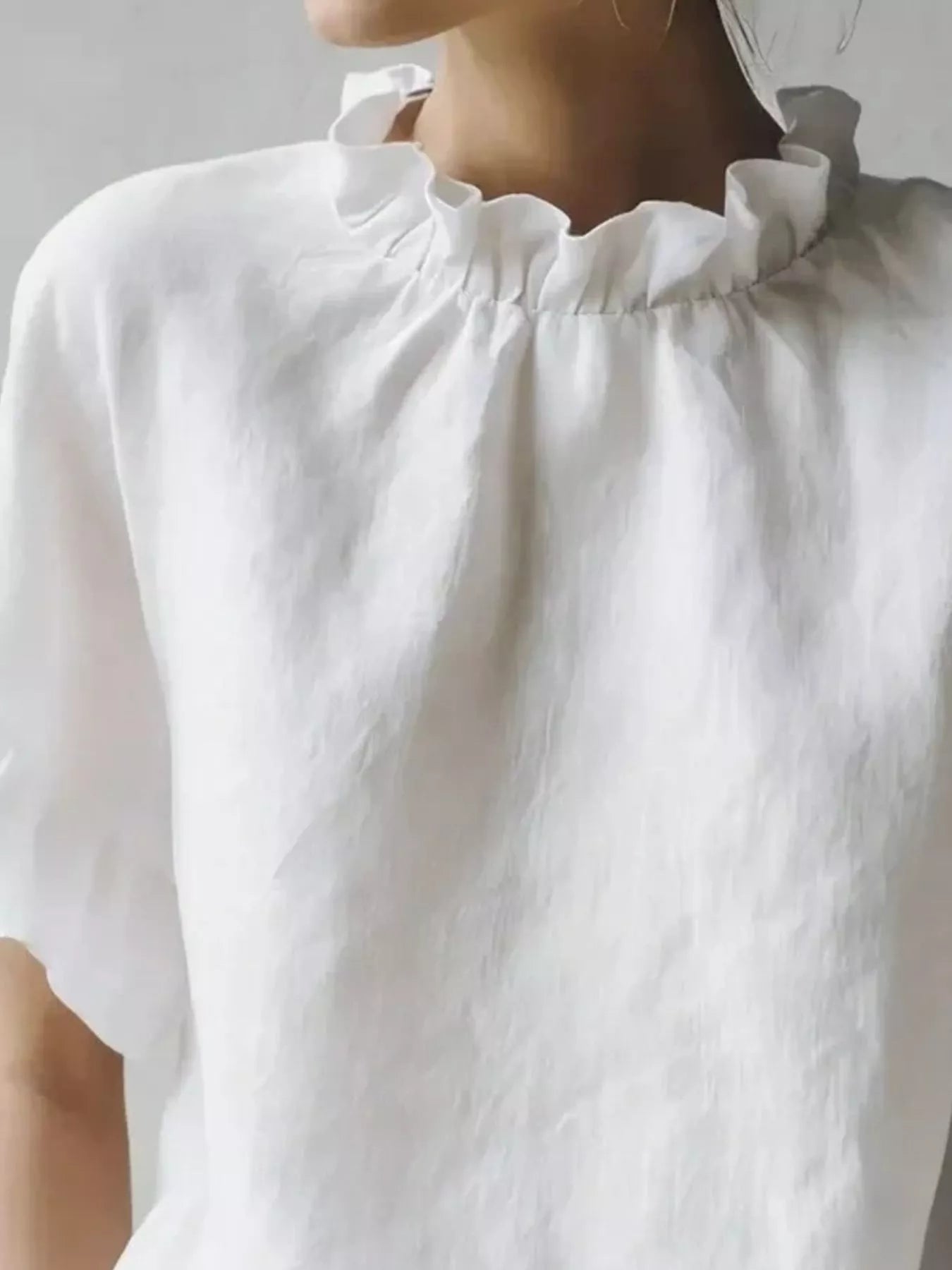 Plus size ruffled neck half sleeve blouse by Plush Fashion Hub, featuring a full-size, stylish design with elegant ruffle details.