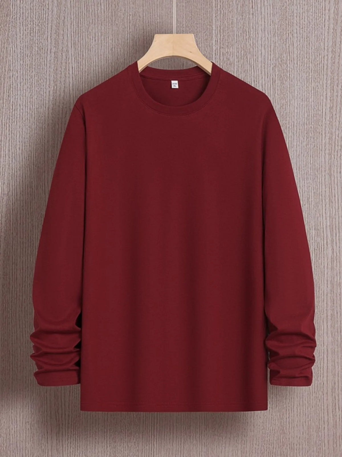 Plus size men's round neck long sleeve T-shirt by Trendsi, in a comfortable fit and casual style, shown in a neutral color.