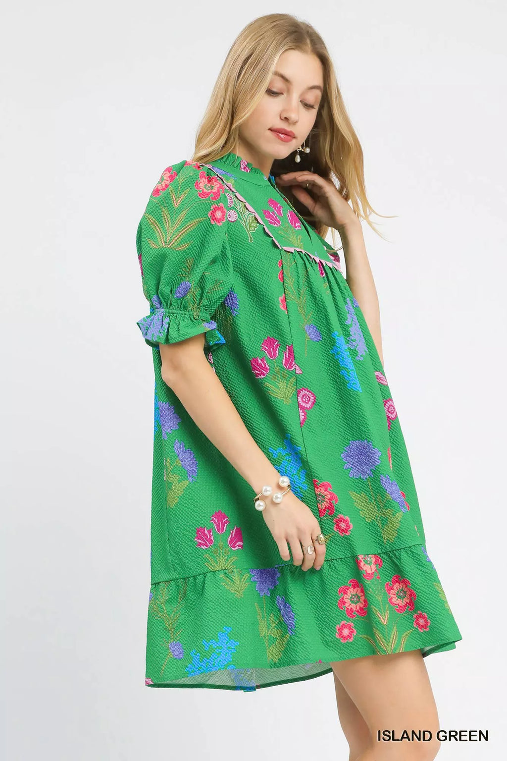 Umgee multi-flower print V-neck dress featuring a flowy fabric and vibrant floral pattern, perfect for casual and summer wear.