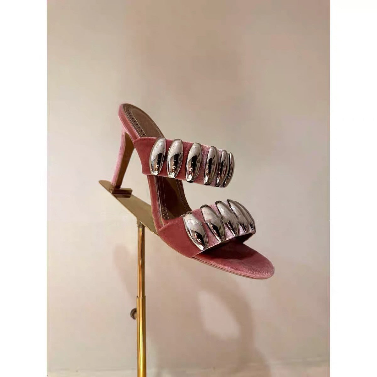 Clear buckle open-toe stilettos heels by eprolo featuring transparent straps and a sleek, high-heeled design.