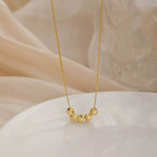Sterling silver beaded necklace with small round beads, stylish jewelry piece by Shopimist on a plain background.