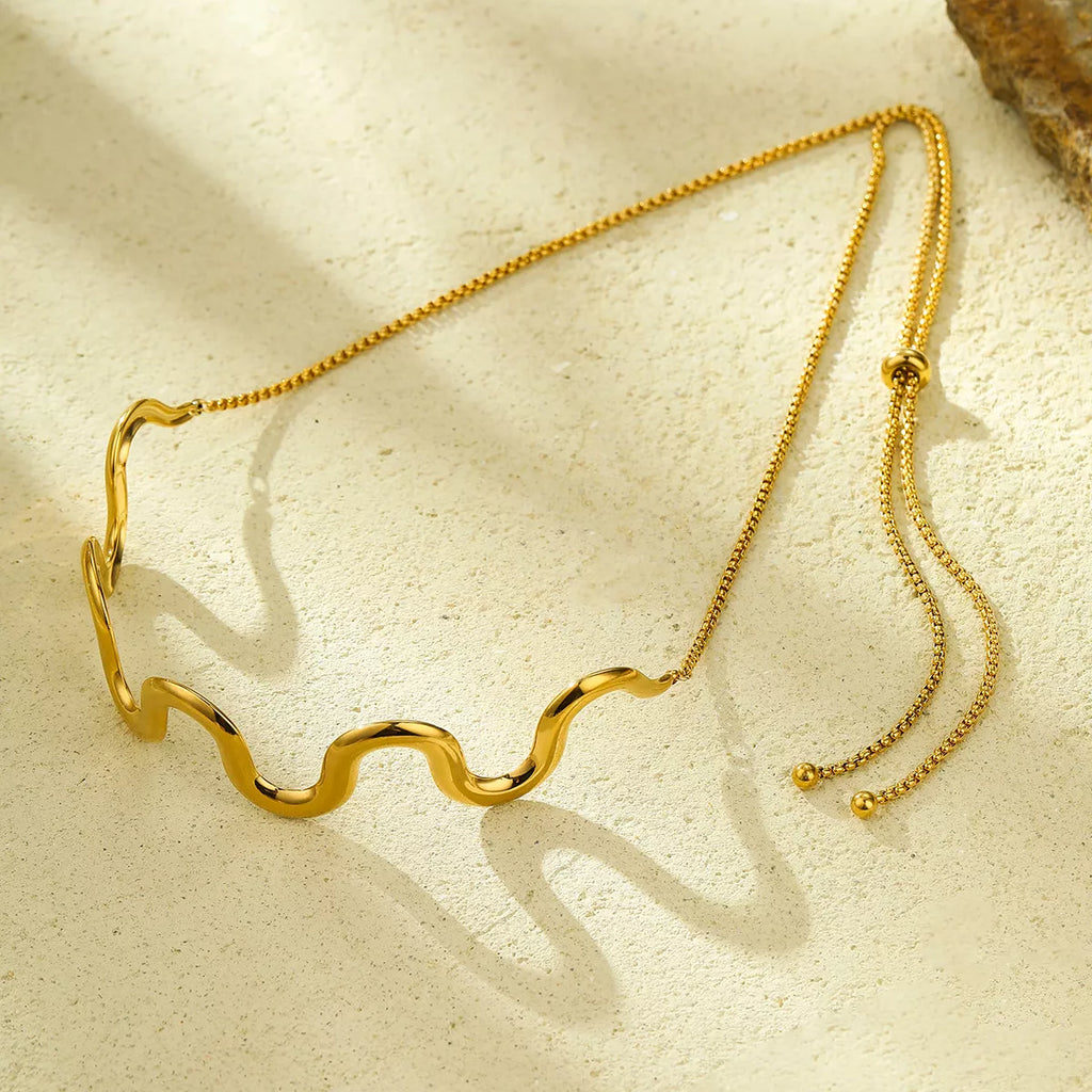 18K gold-plated wave necklace with sleek, flowing design, showcasing a stylish jewelry piece from Shopimist.