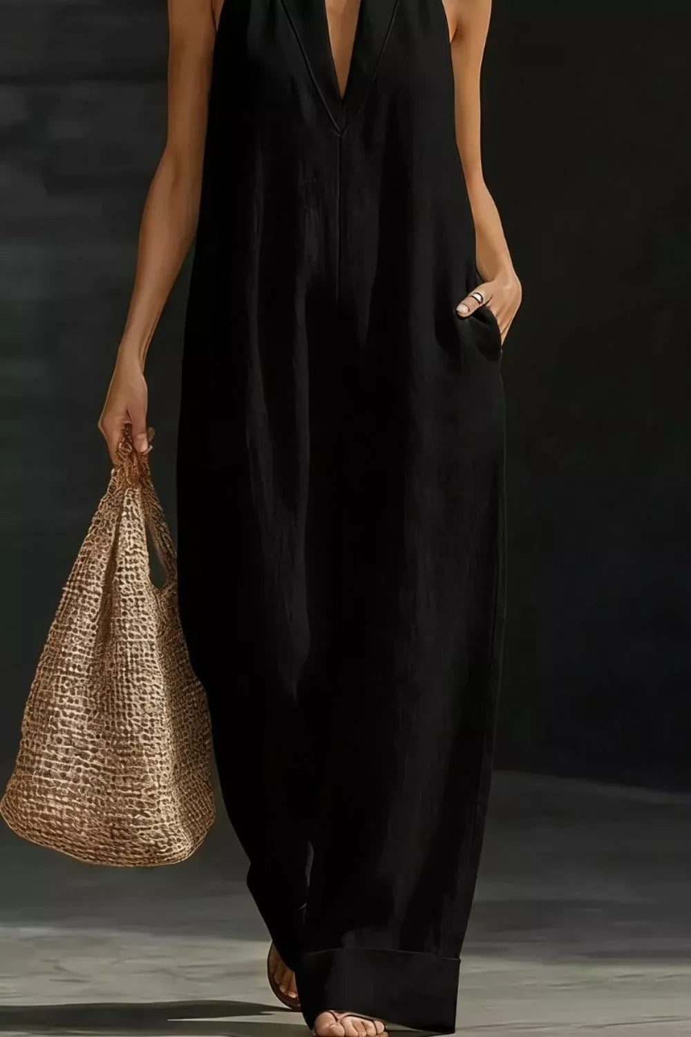 Women's sleeveless wide-leg jumpsuit with pockets, casual chic romper by Trendsi, shown in a stylish fit with pockets and relaxed silhouette.