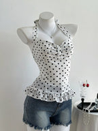 Polka dot halter neck camisole top by Plush Fashion Hub, featuring a stylish polka dot pattern and halter neckline.