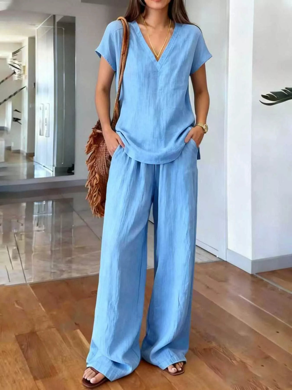 Plus size Trendsi loungewear set with a V-neck short sleeve top and matching pants, comfortable and stylish for relaxing.