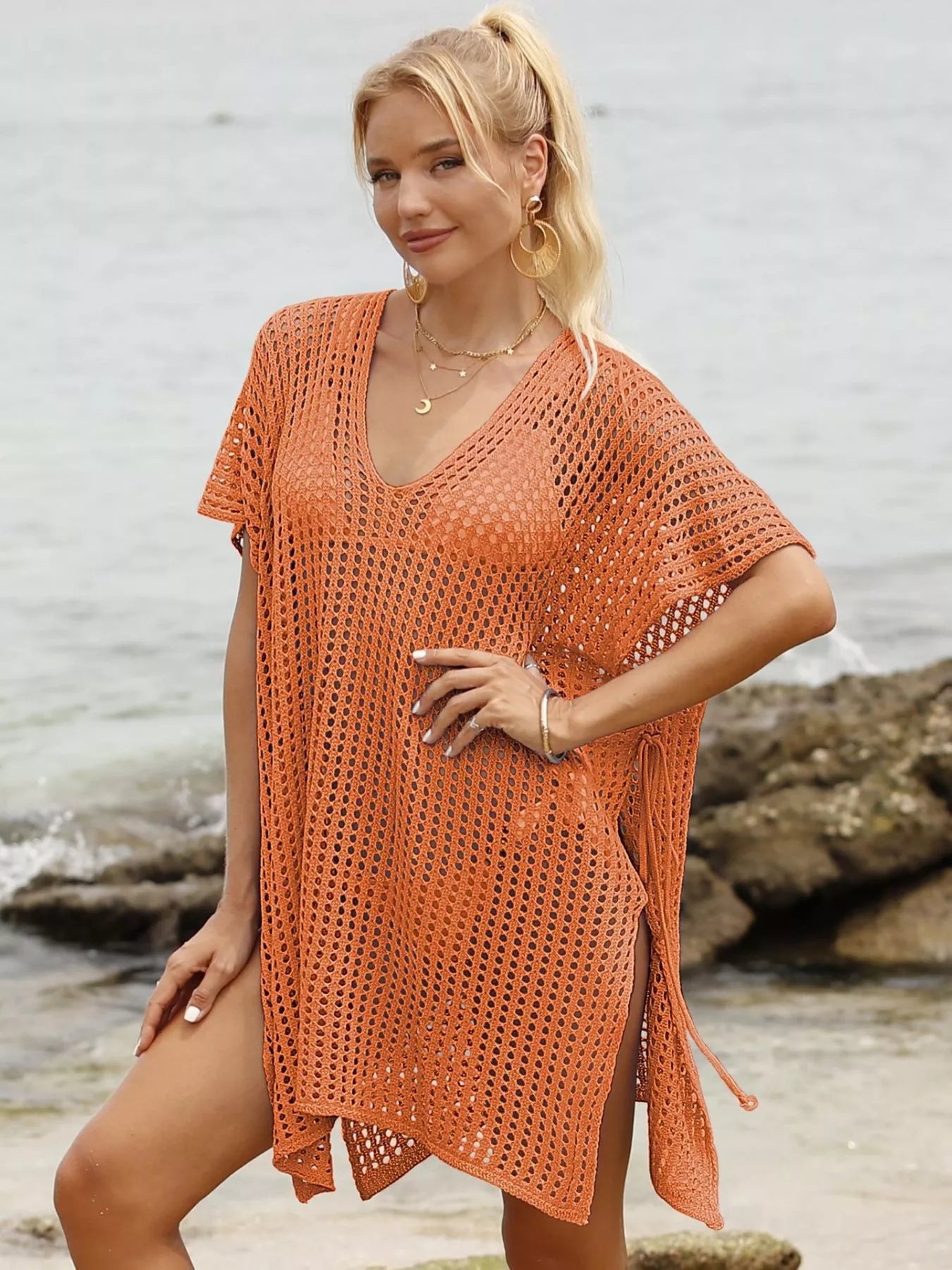 Openwork V-neck slit cover-up by Trendsi featuring lightweight fabric and stylish slit design, perfect for beach or poolside wear.