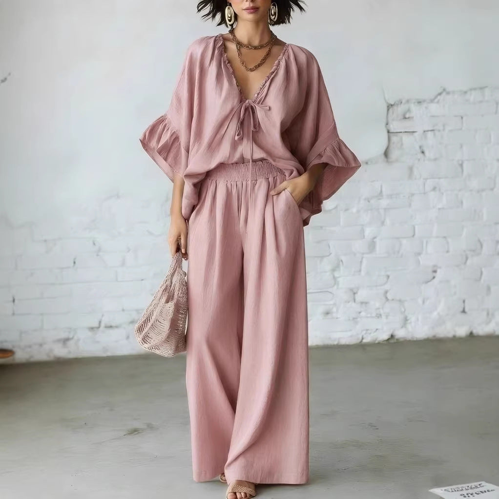 Women's loose-fit V-neck top and wide-leg pants two-piece casualwear set by FitiqueFit, featuring relaxed fit and comfortable fabric.