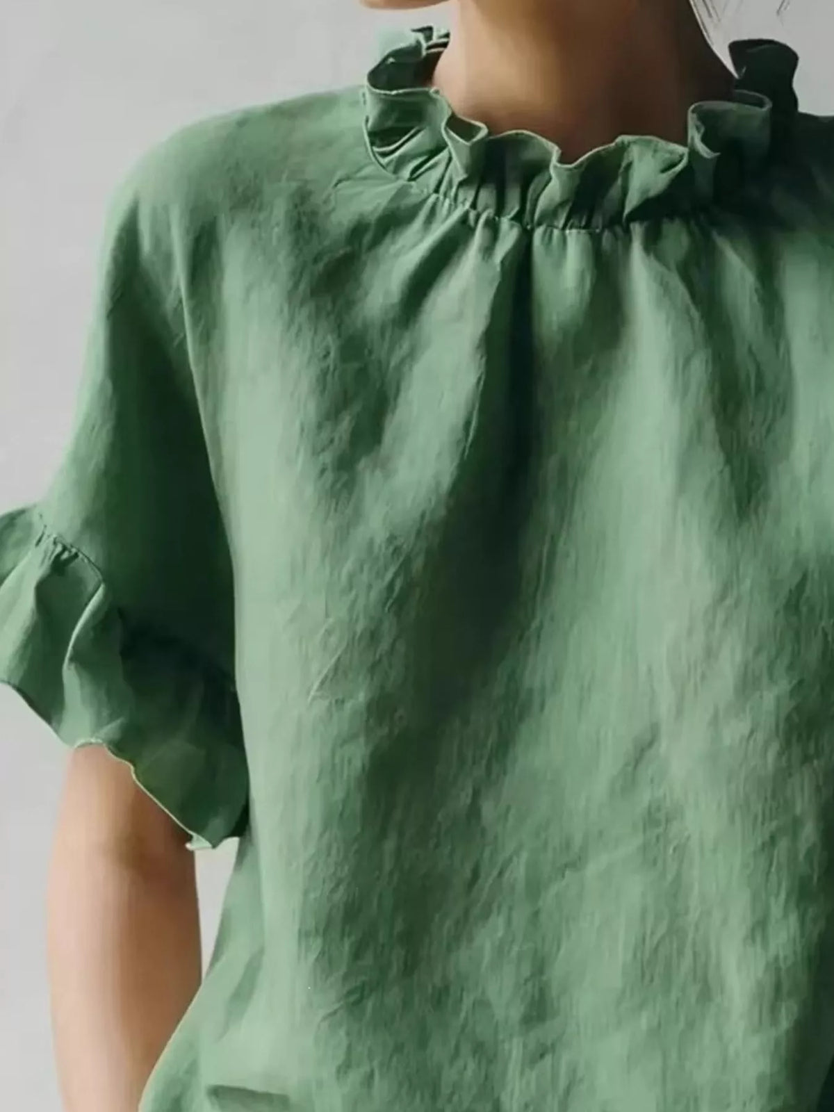 Plus size ruffled neck blouse with half sleeves from Plush Fashion Hub, showcasing a full-coverage fit and stylish design.