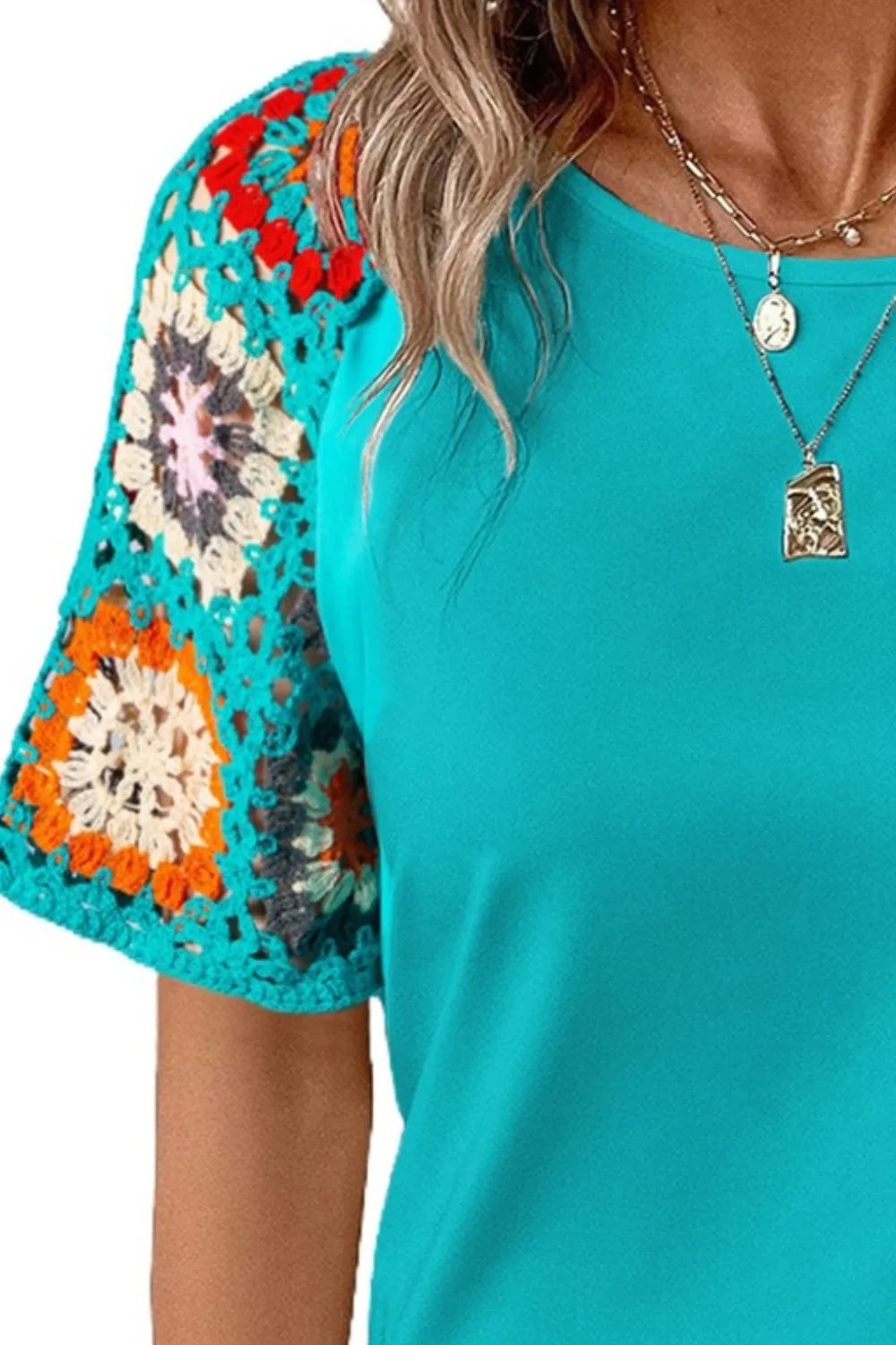 Geometric print round neck short sleeve blouse from Plush Fashion Hub, showcasing a stylish top with vibrant patterns.