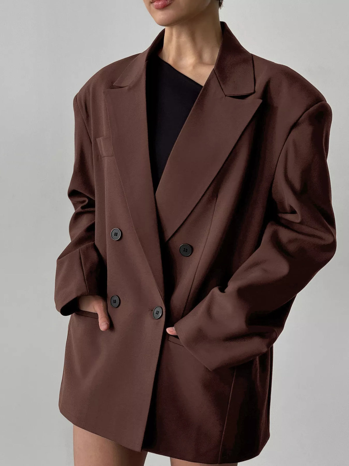 Trendsi double-breasted blazer with lapel collar, tailored fit, in classic neutral color, displayed on a hanger.