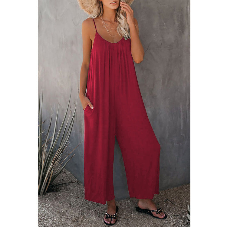 Women’s pleated chest cross-strap jumpsuit by Plush Fashion Hub, featuring a stylish design with pleats and cross-back straps