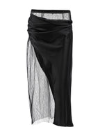 Women's elegant lace midi skirt with sheer split detail, trendy women's apparel by Trendsi, shown in a stylish fashion image.