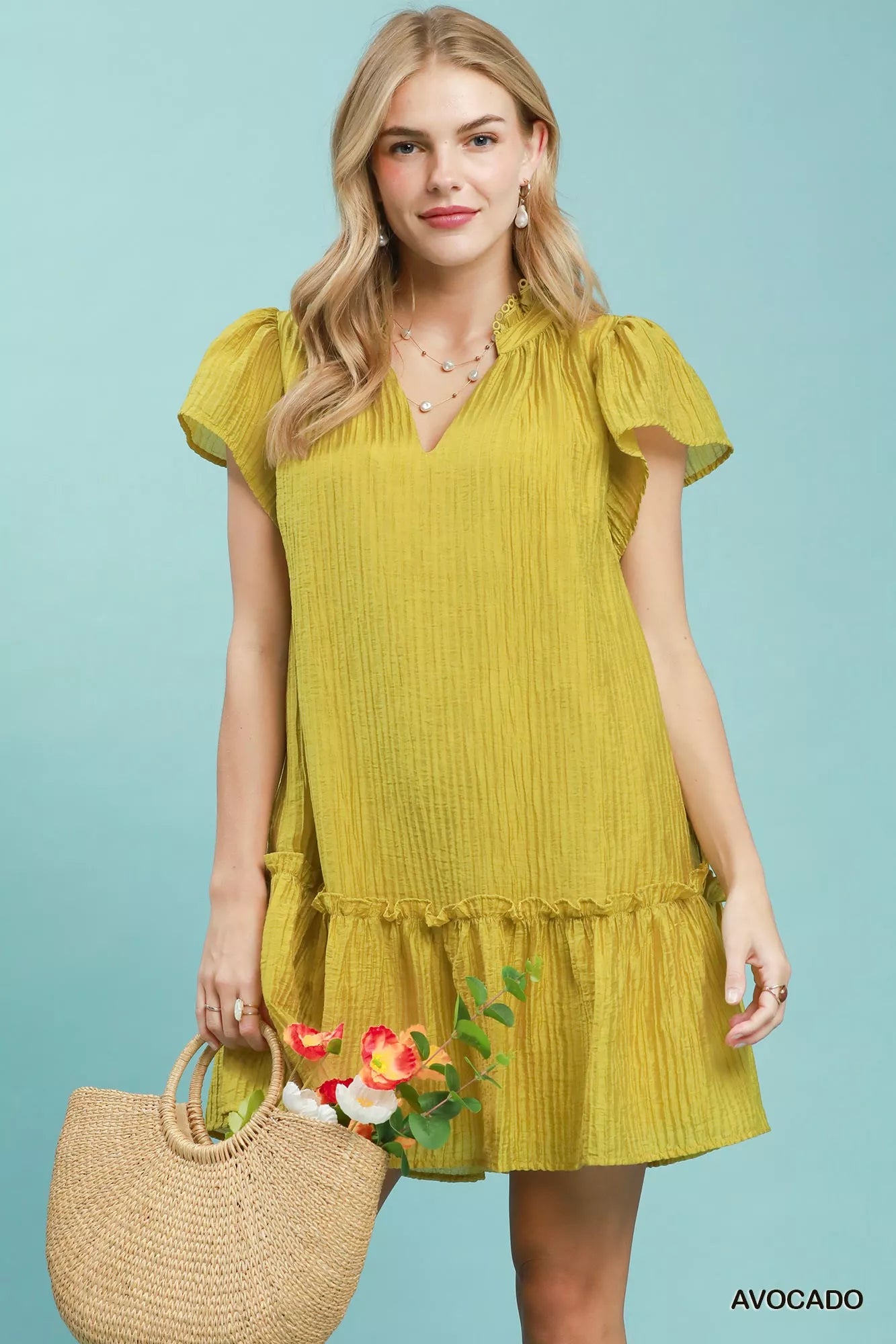 Plush Fashion Hub Umgee textured ruffle hem mini dress, lightweight fabric, sleeveless style, and ruffled detailing on the hem.