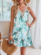 Tropical leaf print V-neck sleeveless dress by Shopimist featuring vibrant green foliage and lightweight fabric.