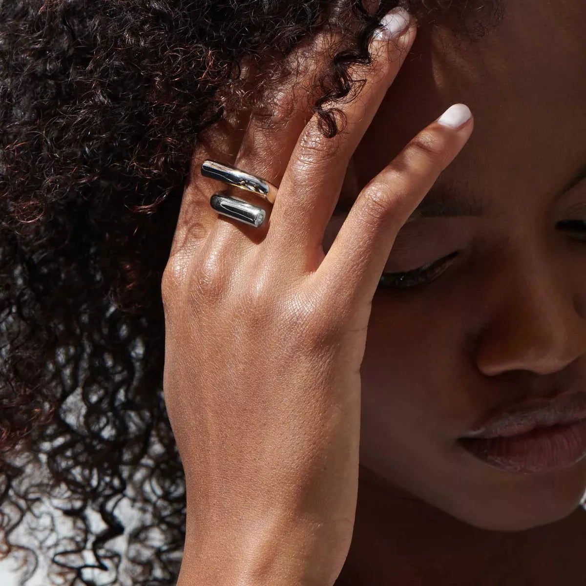 Stainless steel bypass ring from Plush Fashion Hub, featuring a sleek, modern design with overlapping bands.