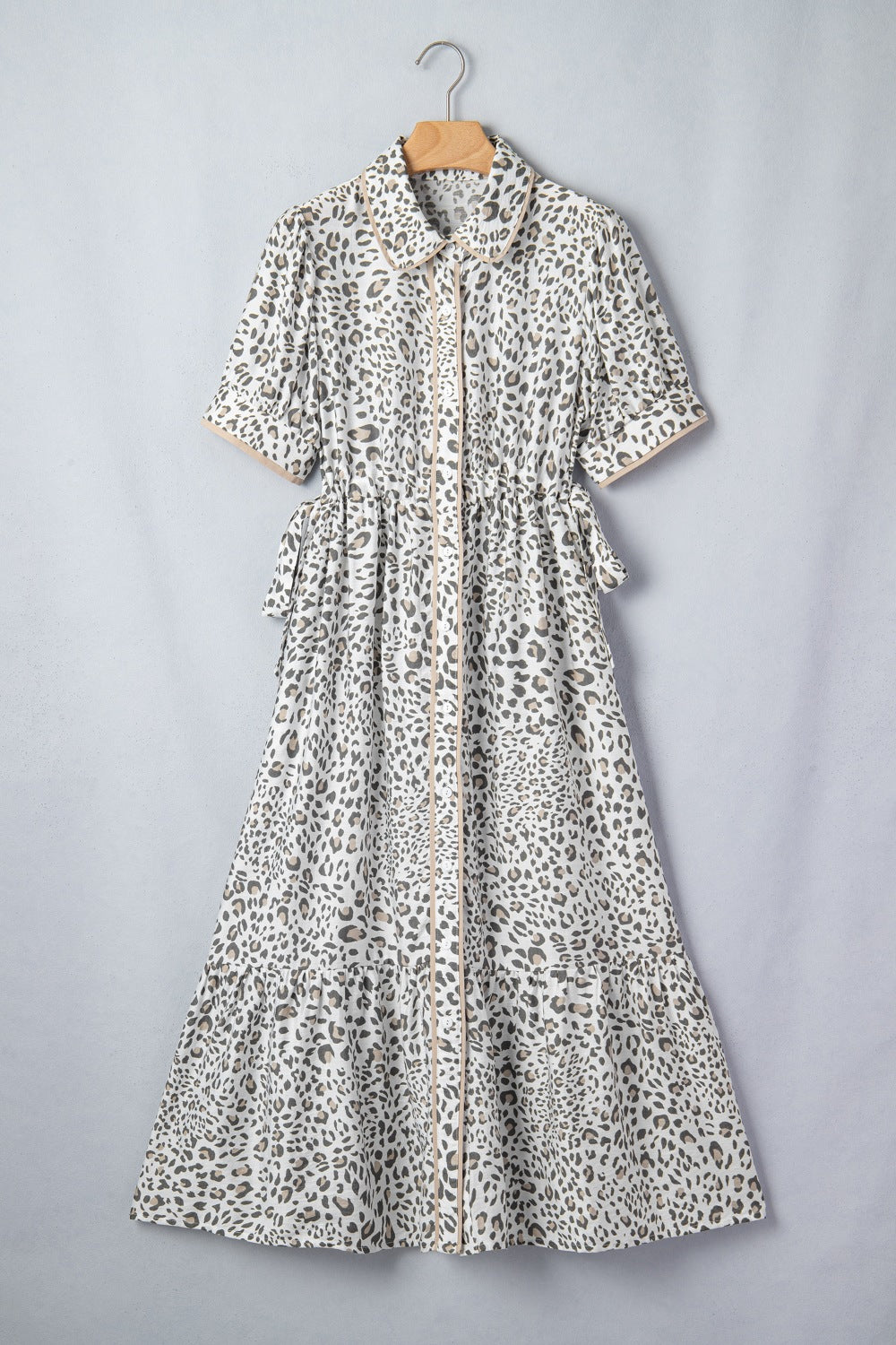 Women's leopard print button-down midi dress by Trendsi, casual chic viscose blend dress with long sleeves and a relaxed fit.