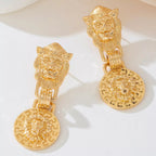 18K gold-plated lion head medallion drop earrings with intricate detailing and bold design for a striking jewelry statement.