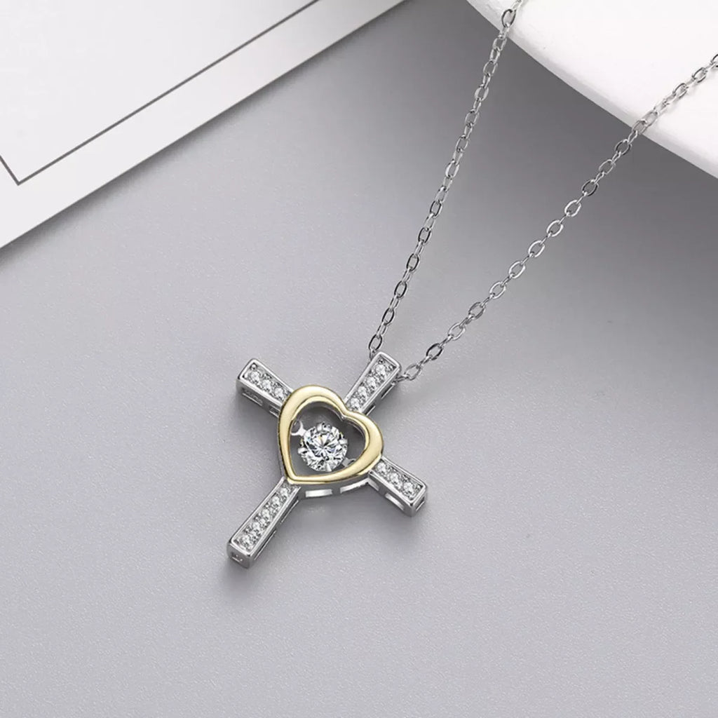 Sterling silver heart cross necklace with detailed design, crafted from 925 silver, featuring a delicate chain and religious pendant.