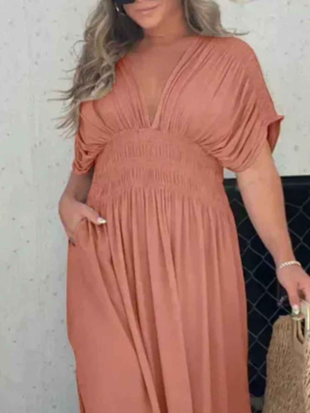 Plus size maxi dress with slit V-neck and smocked waist, trendy full-length dress from Trendsi featuring a flowing silhouette.