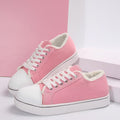 Women's lightweight canvas sneakers with lace-up design and flat low-top style from Plush Fashion Hub.