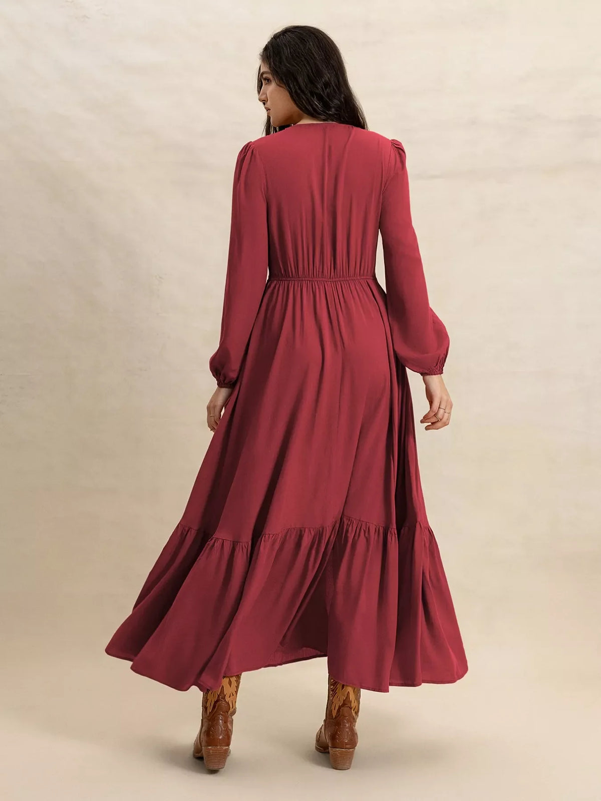 Plush Fashion Hub plus size maxi dress with V-neckline and balloon sleeves, flowing fabric, and elegant design.