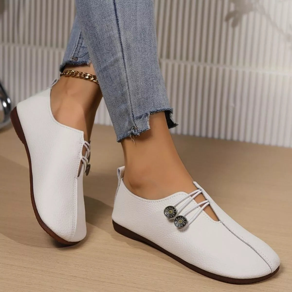 Women's casual slip-on shoes with button details, stylish and comfortable, from Trendsi.