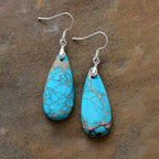 Natural stone copper teardrop earrings with elegant design, featuring polished copper and smooth stone drops for stylish jewelry.