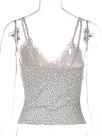 Women's leopard print cami top with delicate lace trim, stylish animal print top by Trendsi, featuring a fitted sleeveless design.