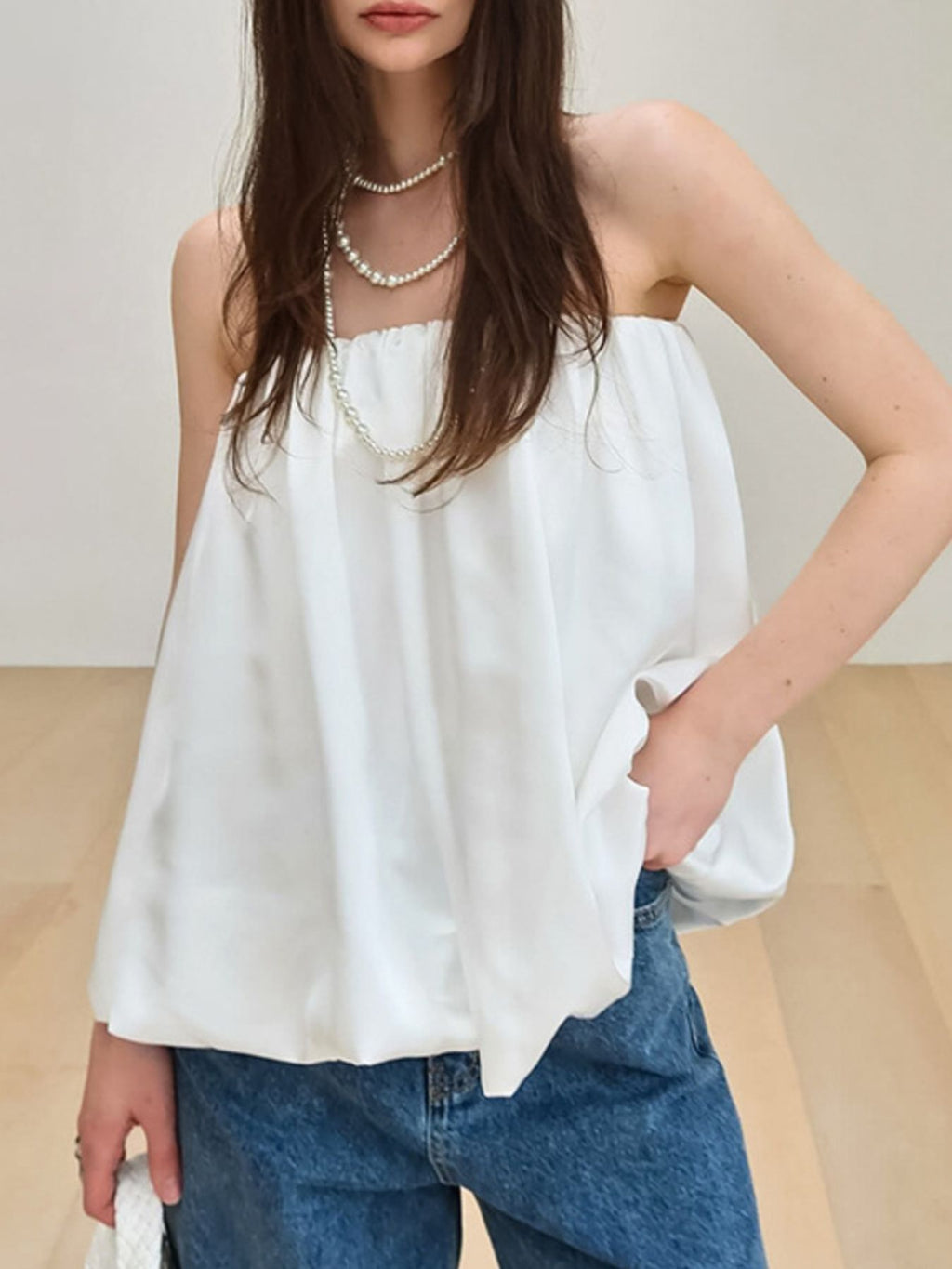 Women's strapless bubble hem tube top by Plush Fashion Hub featuring a sleek, minimalist crop top design with a trendy, fitted style.