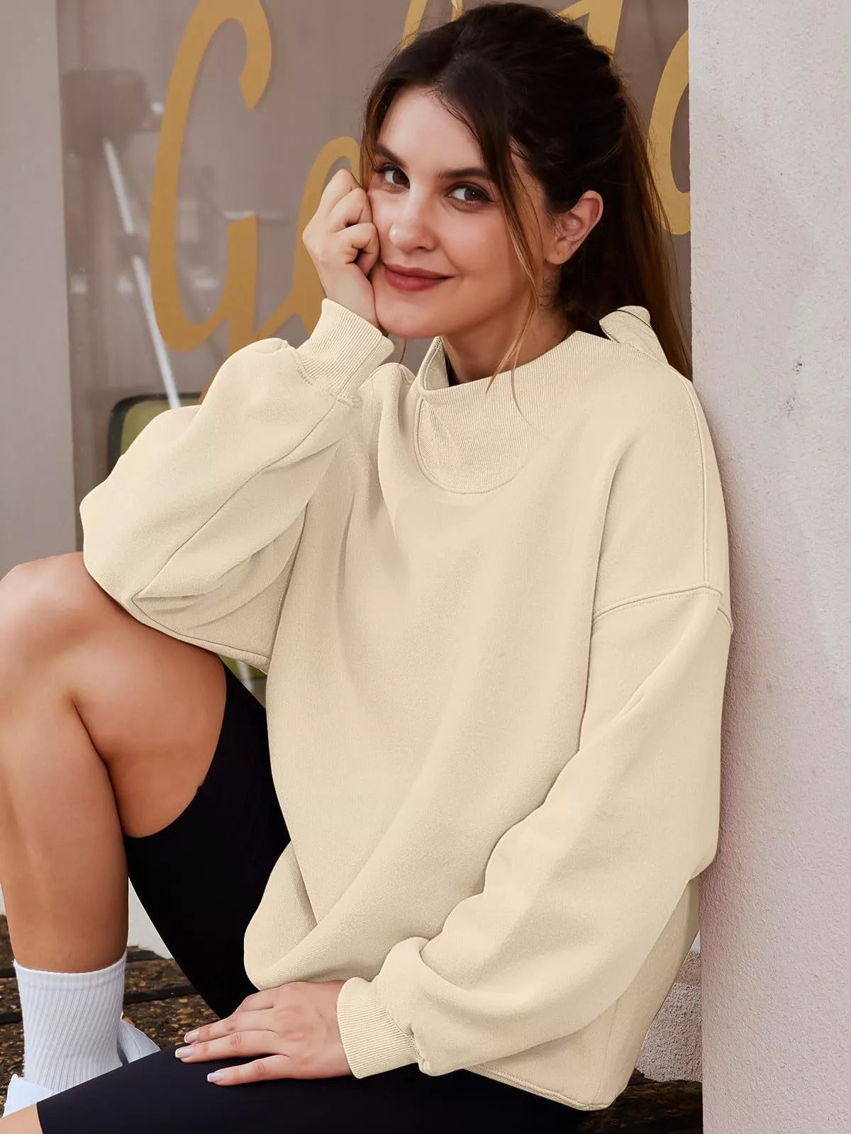 Women's oversized mock neck sweatshirt with dropped shoulders, casual style, soft fabric, and relaxed fit from Trendsi.