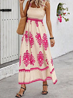 Plush Fashion Hub smocked printed wide strap maxi dress featuring a flowing design and vibrant floral pattern.