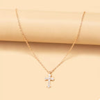 18K gold-plated rhinestone cross necklace with detailed pendant, featuring sparkling stones and a delicate chain.