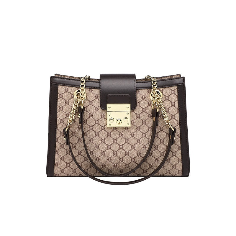 Genuine leather women's fashion bag in black with gold-tone hardware, featuring a shoulder strap and stylish design.