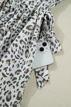 Women's leopard print button-down midi dress from Trendsi, casual chic viscose blend dress with long sleeves and a relaxed fit.