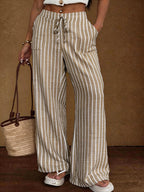 Women's striped wide-leg trousers with lace-up elastic waist and loose fit from Plush Fashion Hub.