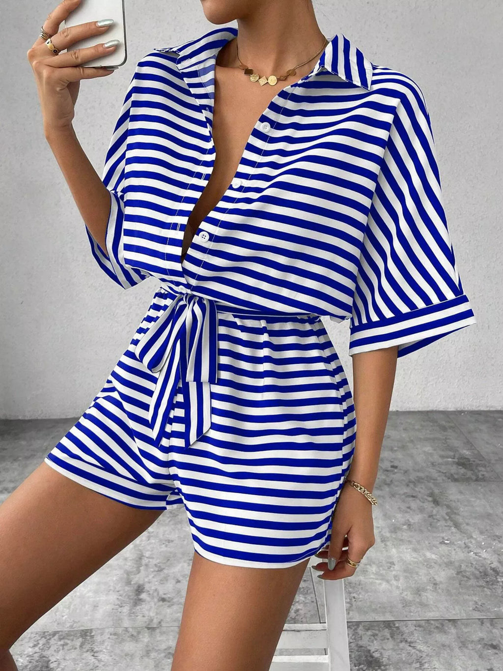 Striped button front half sleeve romper shirt by Plush Fashion Hub, casual style with front buttons and half-length sleeves.