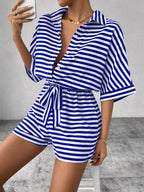 Striped button front half sleeve romper shirt by Plush Fashion Hub, casual style with front buttons and half-length sleeves.
