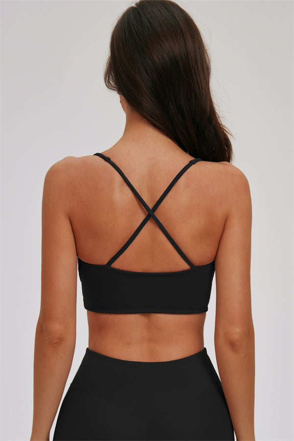 Fitglutes Activewear two-piece sports bra and leggings set featuring a kinetic cross-back design, ideal for gym and workout sessions.