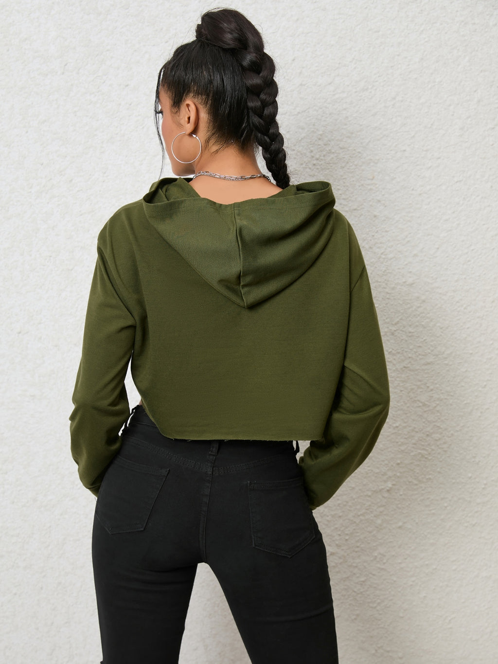Black cutout long sleeve hoodie from Trendsi, featuring a stylish design and fitted silhouette, perfect for casual and trendy outfits.
