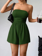Chic strapless ruched waist romper by Trendsi featuring a fitted bodice and flowy shorts, perfect for stylish summer wear.