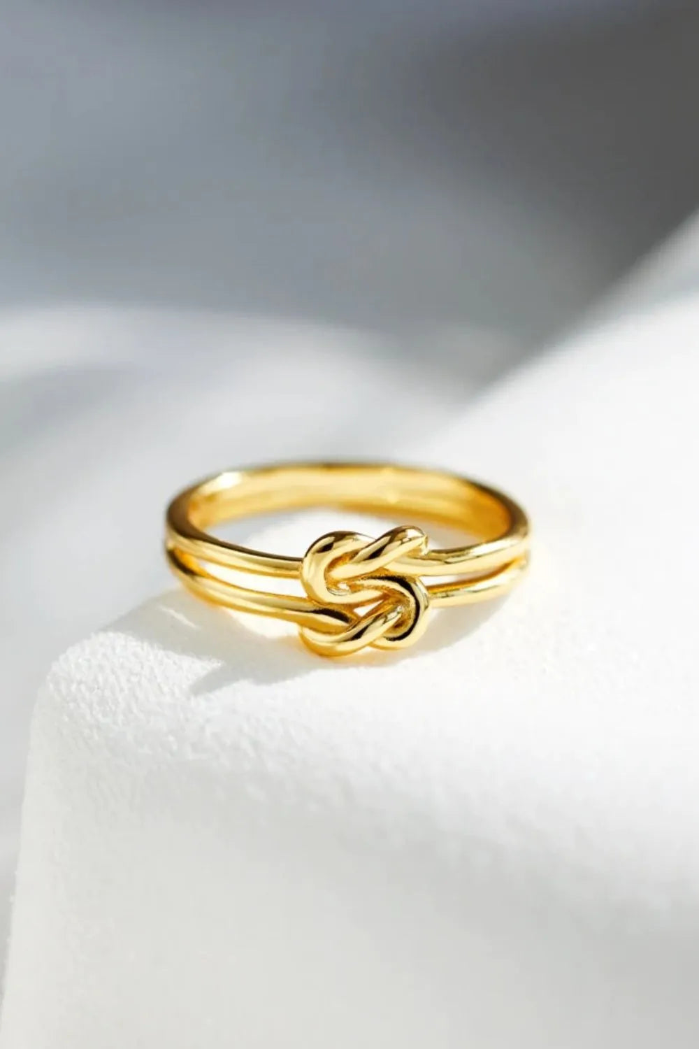 925 Sterling Silver Knotted Ring with intricate design, showcasing polished silver and elegant knot detail.