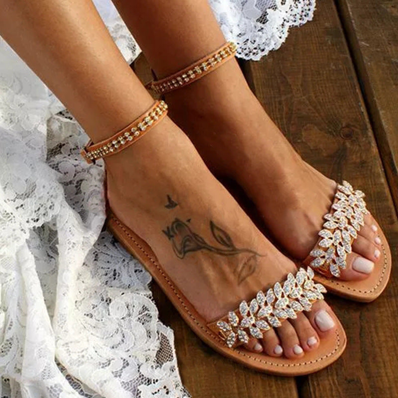 Women's rhinestone flat sandals with large size, buckle strap design, by Plush Fashion Hub, featuring fashionable word accents.